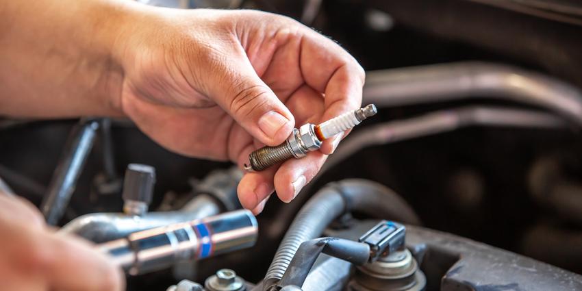 Detail of spark plugs over an engine.